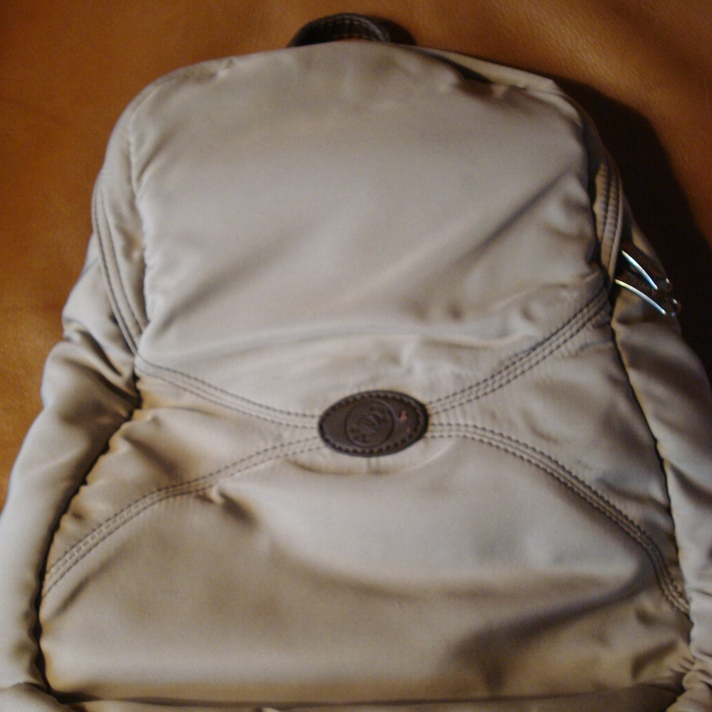 Pacsafe tan small sling/ backpack, antitheft, EUC